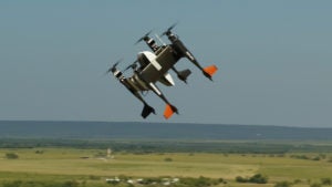 Bell Flight's APT-70 autonomous logistics drone, equipped with Yamato's PUPA-70XG pod, flies above Texas.