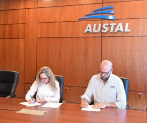 Austal USA President Michelle Kruger and Master Boat Builders President Garrett Rice sign a memorandum of understanding in September 2025 establishing a strategic outsourcing partnership to accelerate Austal’s work on government projects. (Photo: Austal USA).