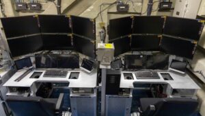 The first installation of the Unmanned Air Warfare Center (UAWC) aboard USS George H.W. Bush (CVN 77), where air vehicle pilots will control future MQ-25 Stingray airborne operations. (Photo: U.S. Navy photo)